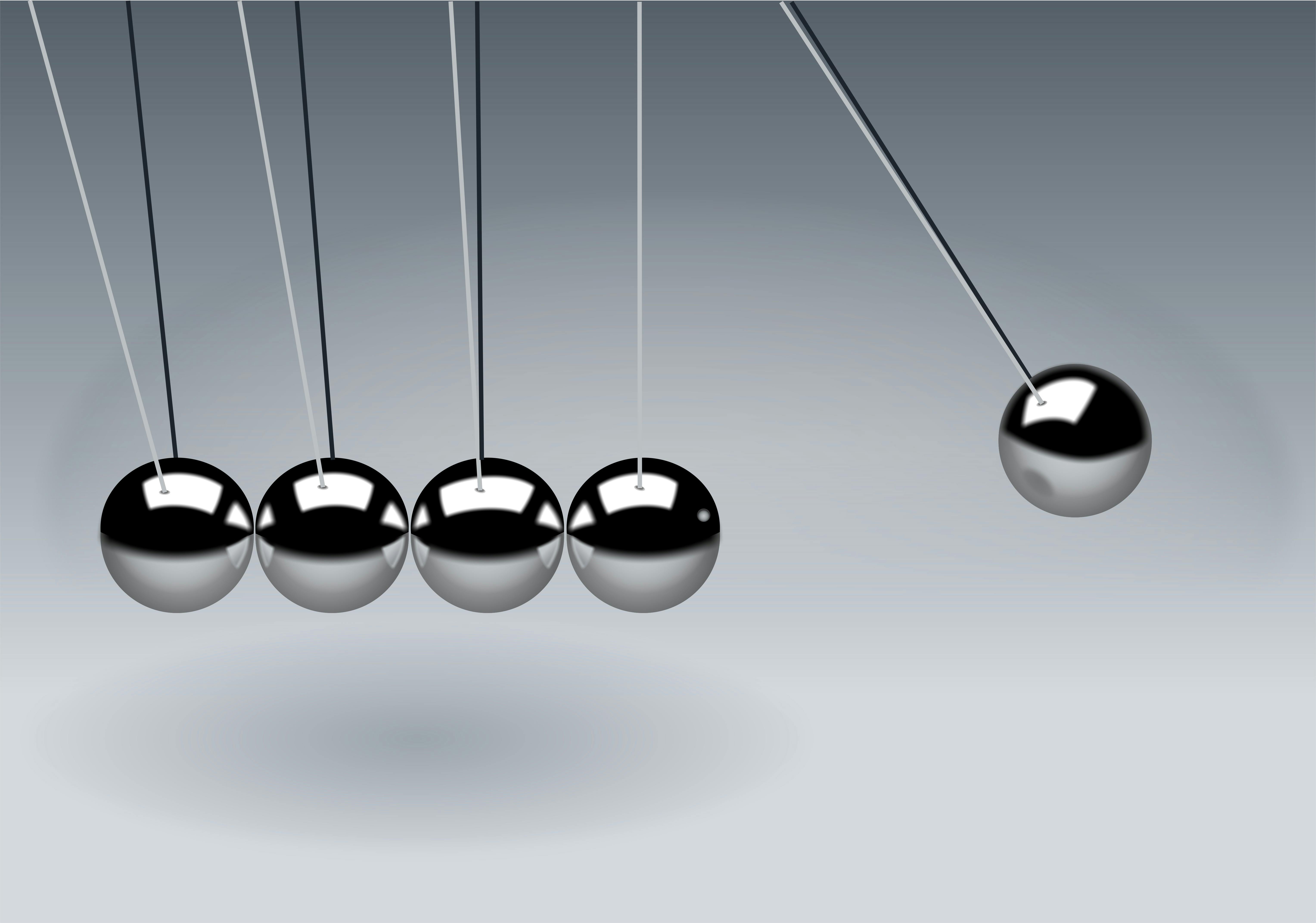 Newton's cradle — every action creates an equal and purposeful reaction