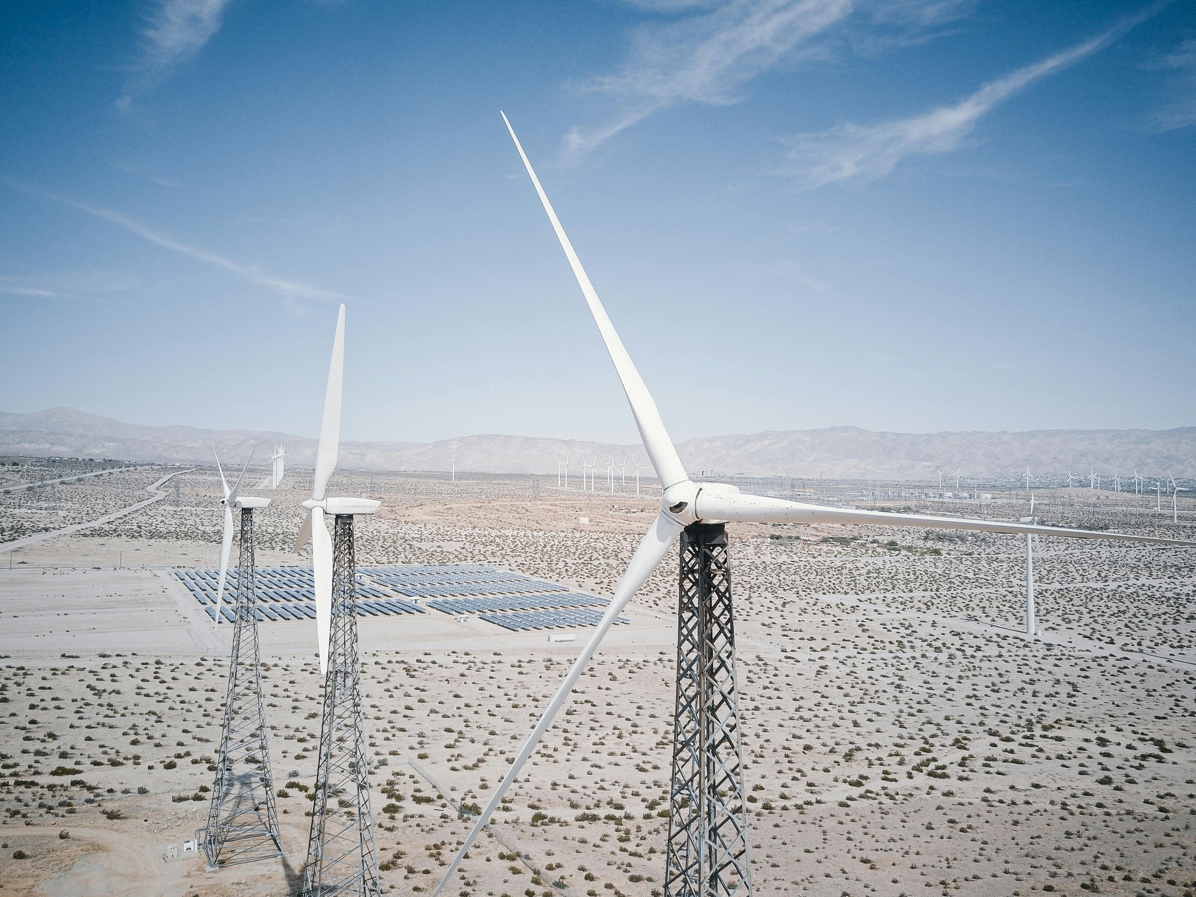 Wind turbines and solar arrays at San Gorgonio Pass Wind Farm, Palm Springs, California — renewable energy at scale